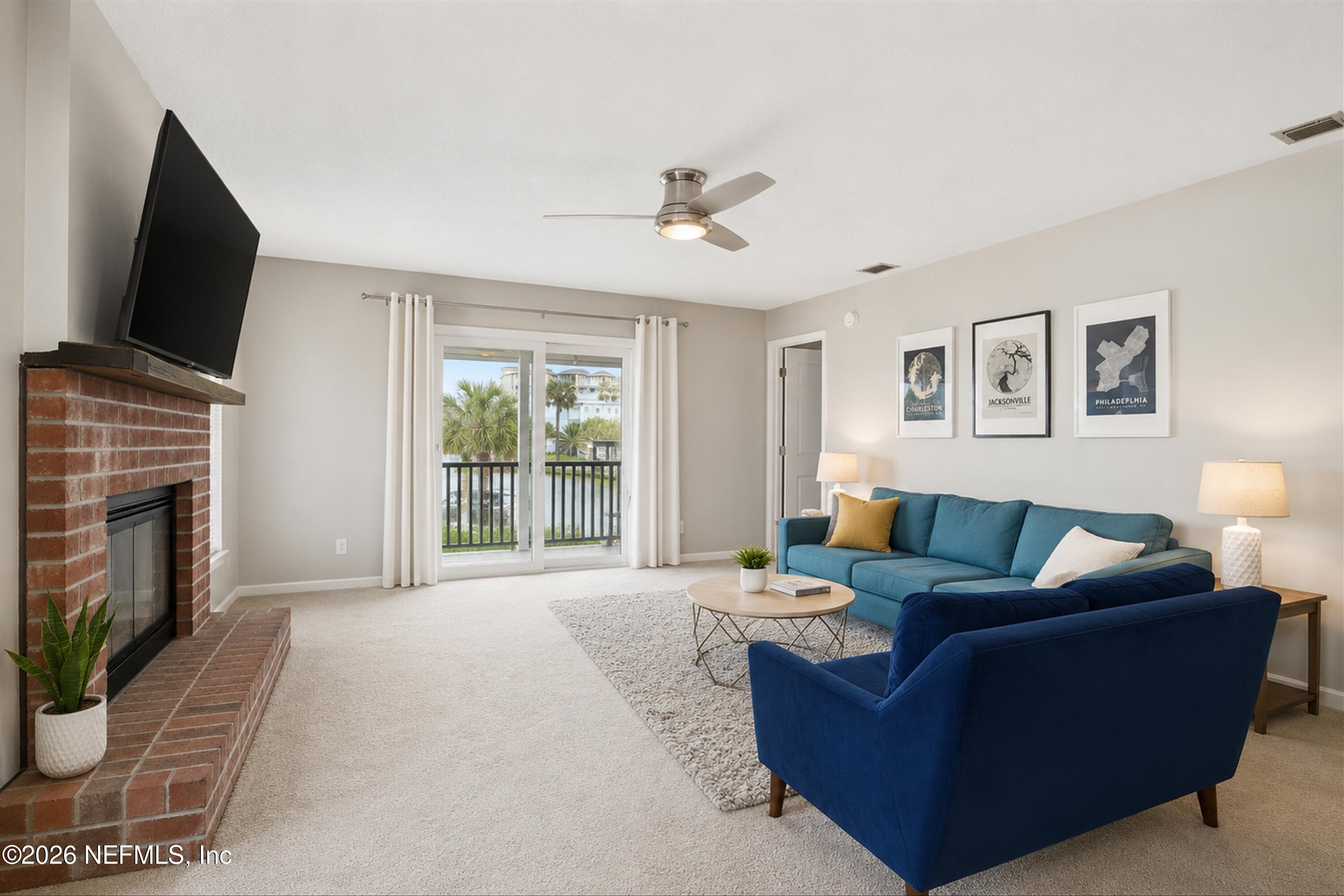 124 Hopkins Street Neptune Beach, FL 32266 - Photo 5 of 44 a living room with furniture and a flat screen tv