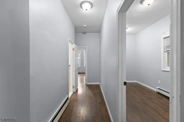 a bathroom with a sink a toilet a mirror and bathtub