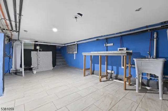 a kitchen with a refrigerator sink and cabinets
