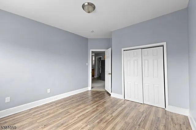 a bedroom with bed and a window