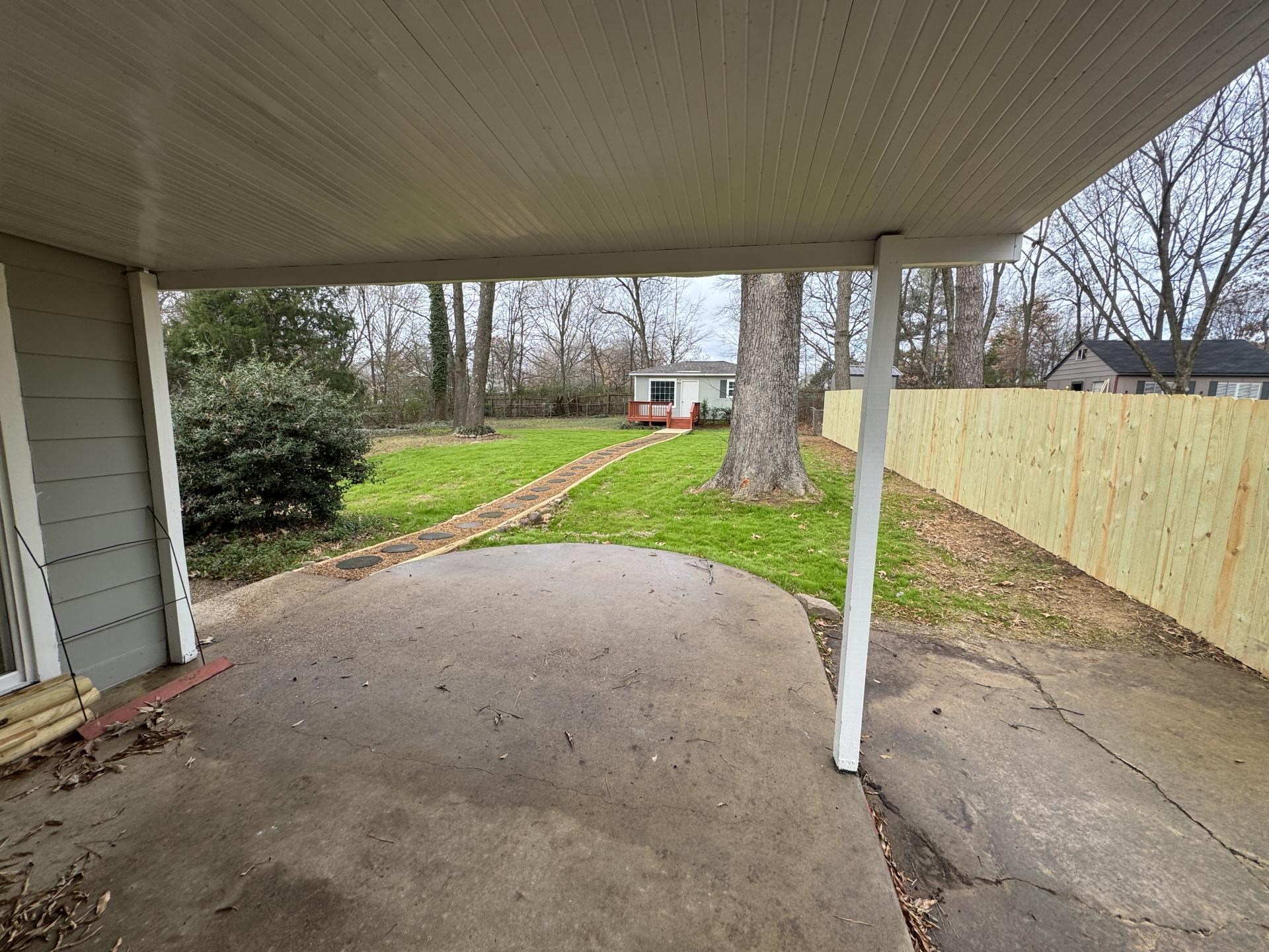 2823 Elmore Park Road Bartlett, TN 38134 - Photo 14 of 22 Fenced backyard with an outdoor structure and a patio area