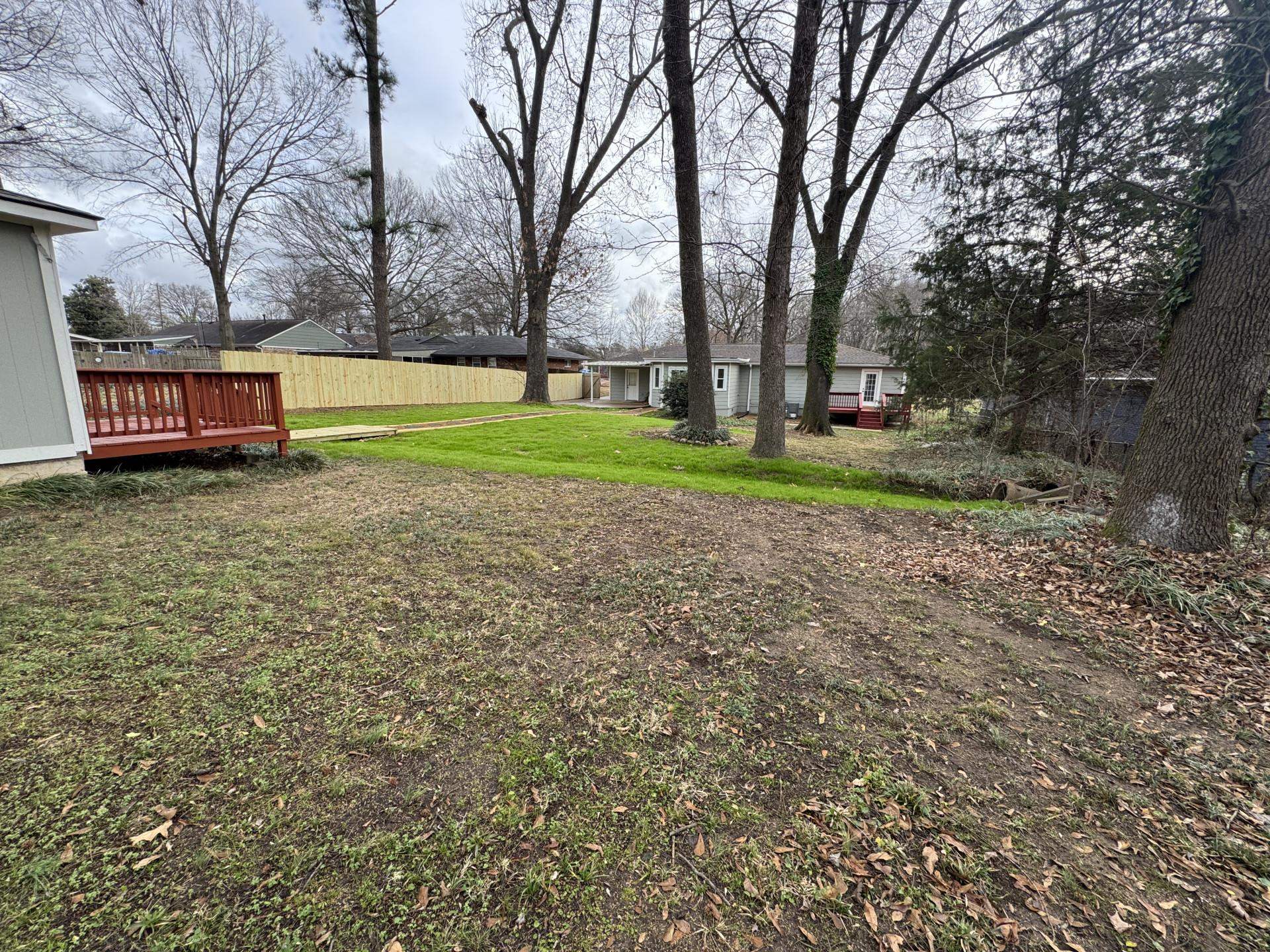 2823 Elmore Park Road Bartlett, TN 38134 - Photo 16 of 22 View of yard featuring a deck