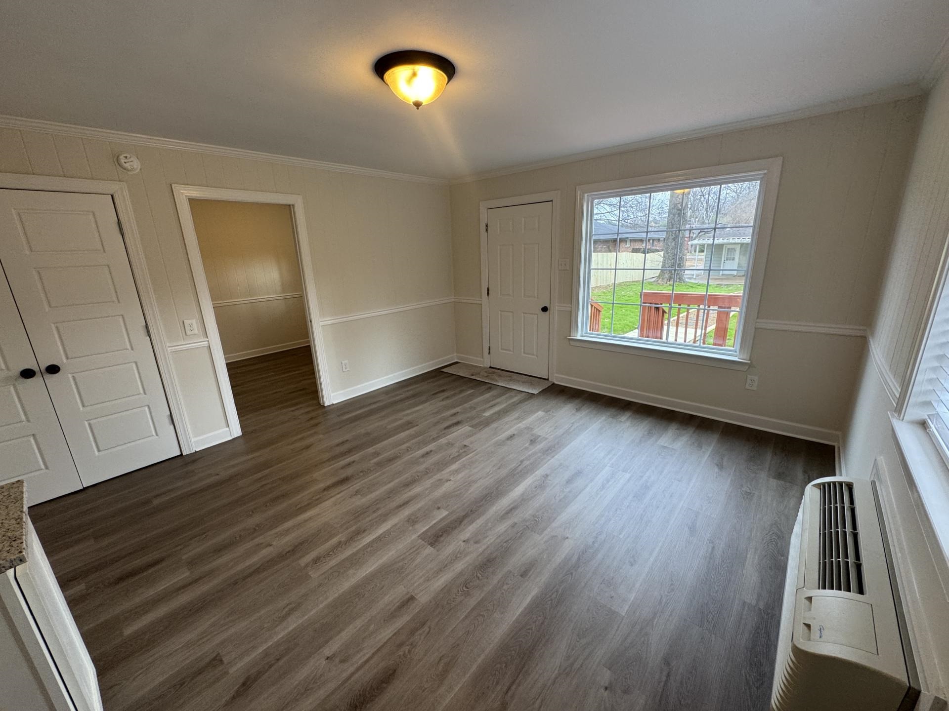 2823 Elmore Park Road Bartlett, TN 38134 - Photo 20 of 22 Unfurnished room with dark wood finished floors and crown molding