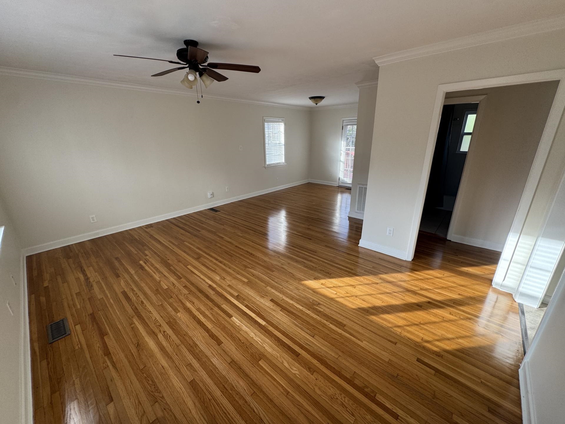2823 Elmore Park Road Bartlett, TN 38134 - Photo 2 of 22 Unfurnished room with light wood finished floors, a ceiling fan, and crown molding