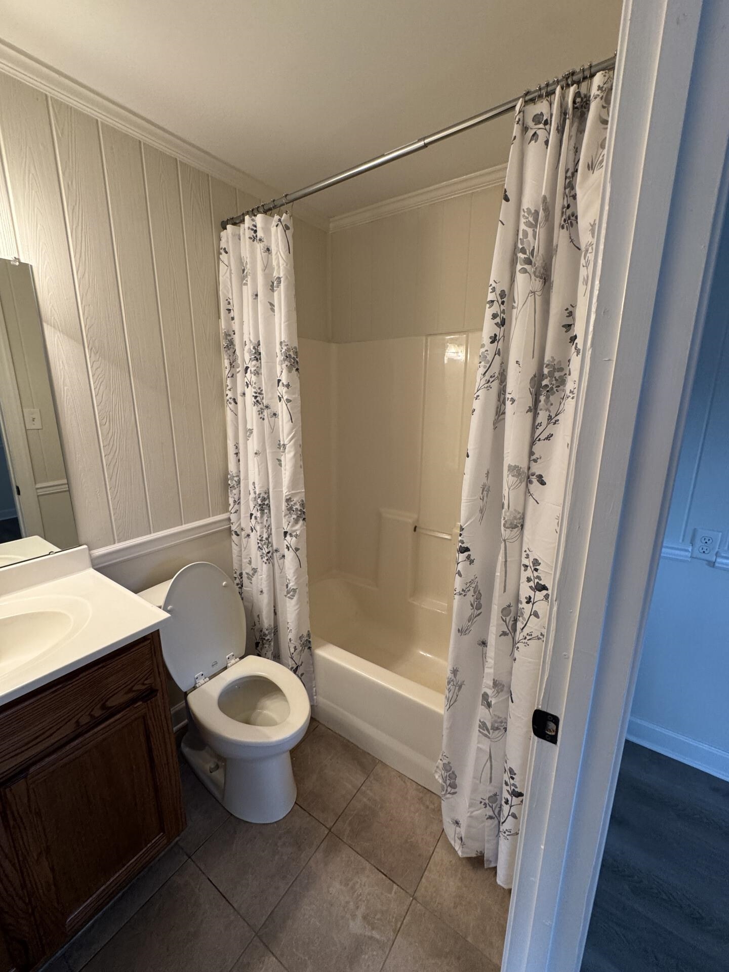 2823 Elmore Park Road Bartlett, TN 38134 - Photo 21 of 22 Full bathroom featuring shower / bathtub combination with curtain, vanity, crown molding, and dark tile patterned floors