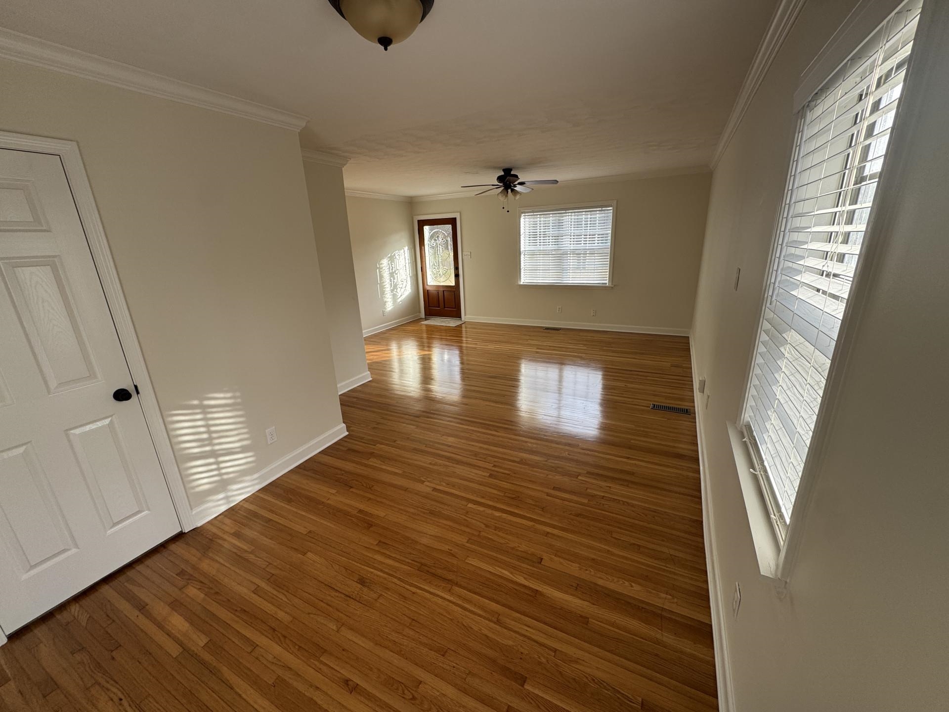 2823 Elmore Park Road Bartlett, TN 38134 - Photo 3 of 22 Unfurnished room with hardwood / wood-style floors, ornamental molding, and ceiling fan
