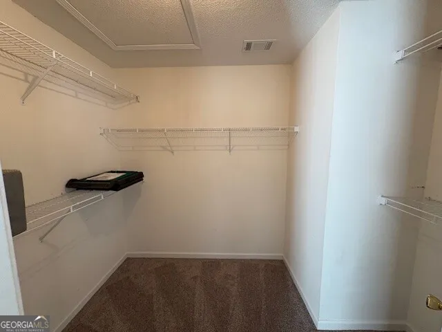 a view of a room with racks on the wall