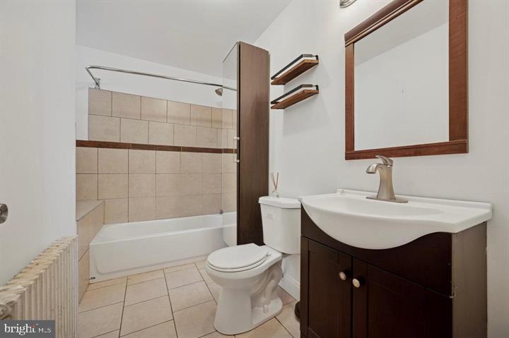 2467 79th Avenue, Unit 1 Philadelphia, PA 19150 - Photo 12 of 16 a bathroom with a sink toilet and shower