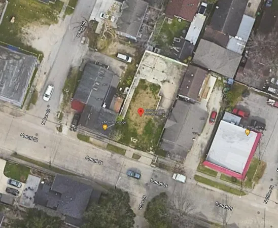 an aerial view of residential house with parking