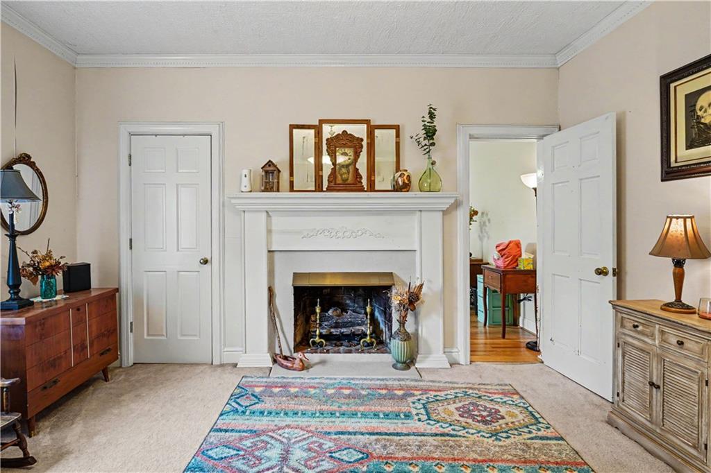 355 Inman Road Hampton, GA 30228 - Photo 9 of 47 a living room with furniture and a fireplace