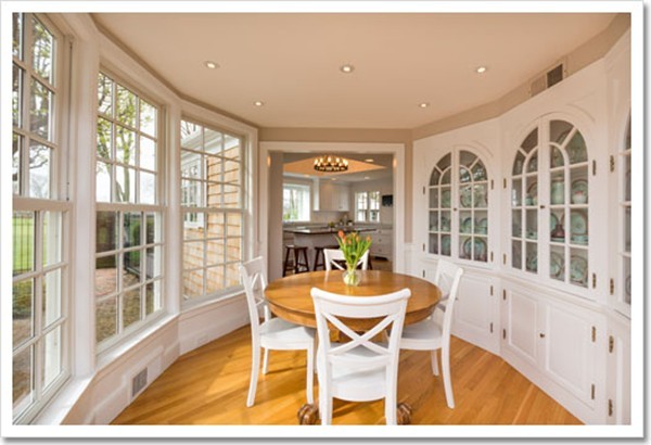 95 Gannett Road Scituate, MA 02066 - Photo 13 of 30 a dining room with furniture a chandelier and wooden floor