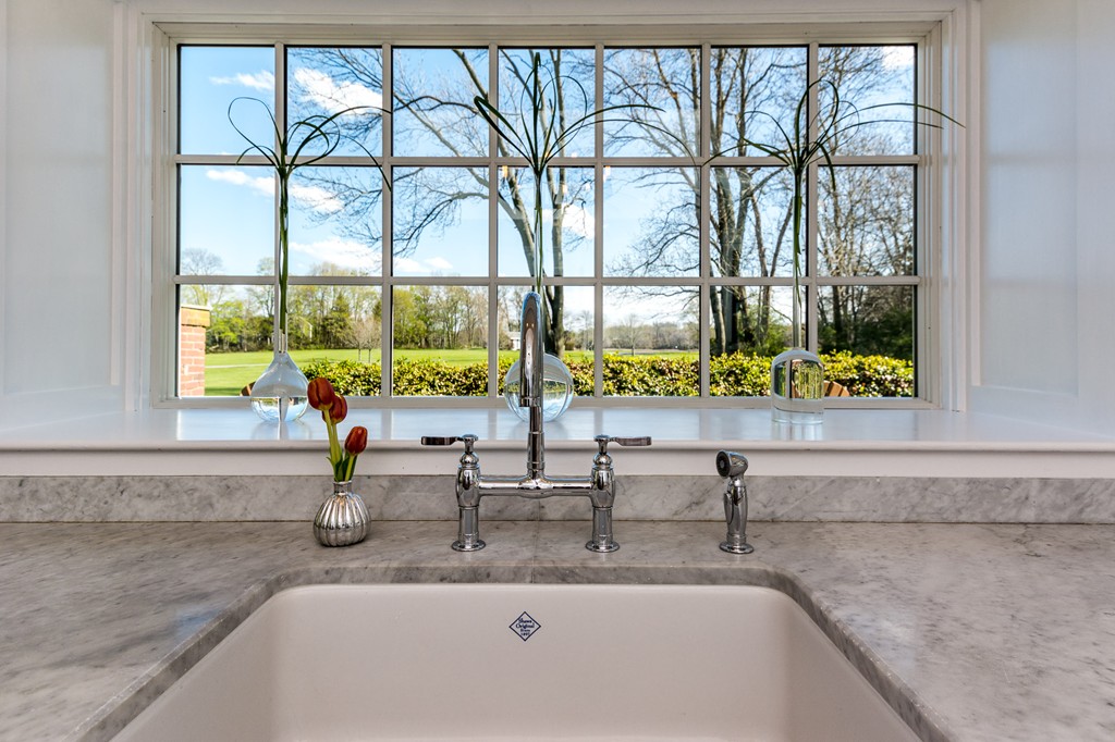 95 Gannett Road Scituate, MA 02066 - Photo 15 of 30 a bathroom with a granite countertop sink and a large window