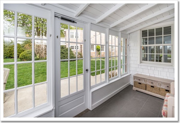 95 Gannett Road Scituate, MA 02066 - Photo 17 of 30 a living room with a large window and floor to ceiling window