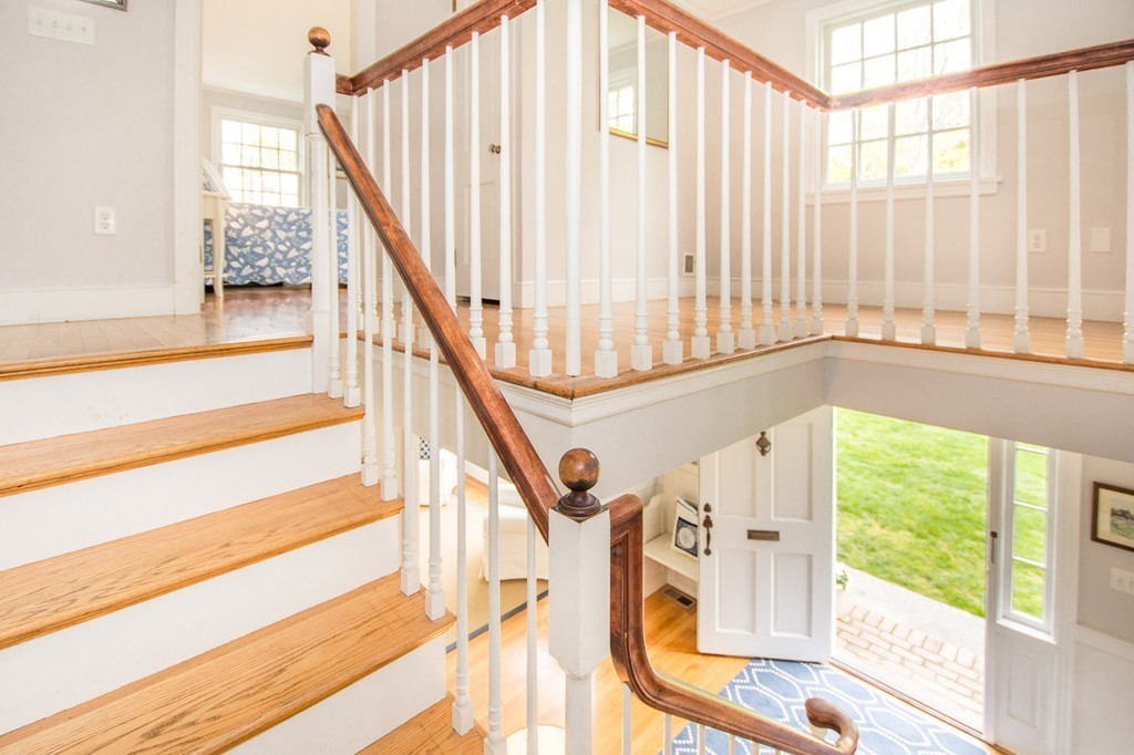 95 Gannett Road Scituate, MA 02066 - Photo 20 of 30 a view of entryway with wooden floor and front door