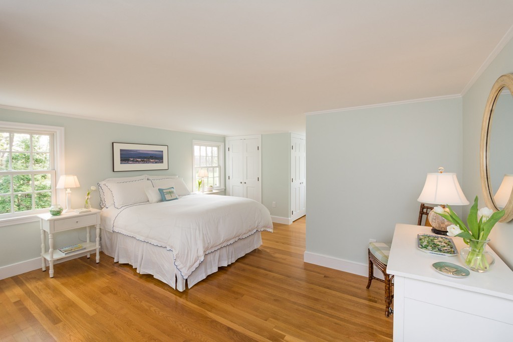 95 Gannett Road Scituate, MA 02066 - Photo 21 of 30 a bedroom with a bed table flowerpot and window