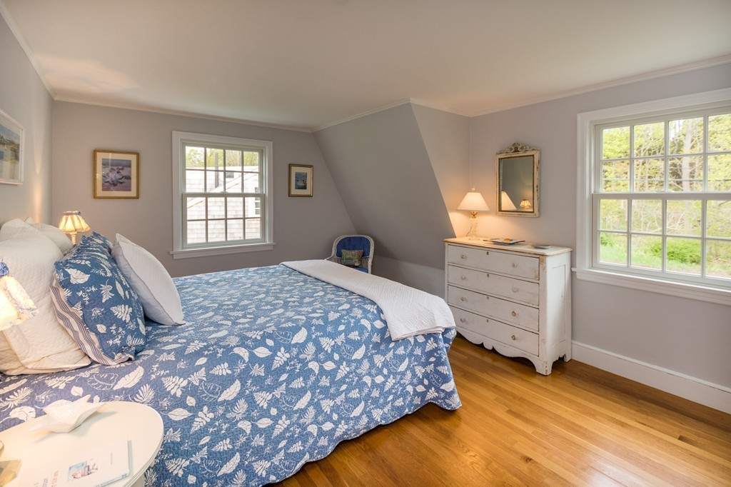 95 Gannett Road Scituate, MA 02066 - Photo 23 of 30 a bedroom with a bed and a window
