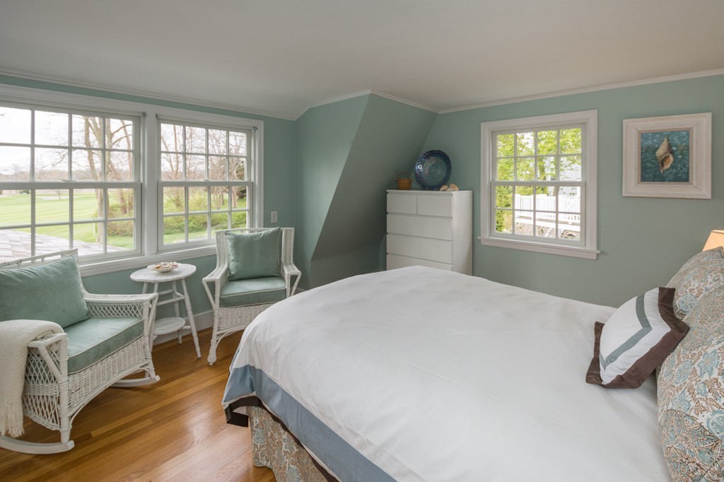 95 Gannett Road Scituate, MA 02066 - Photo 24 of 30 a bedroom with a bed and a large window