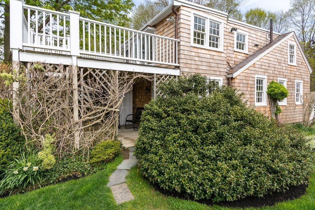 95 Gannett Road Scituate, MA 02066 - Photo 27 of 30 a house view with a garden space