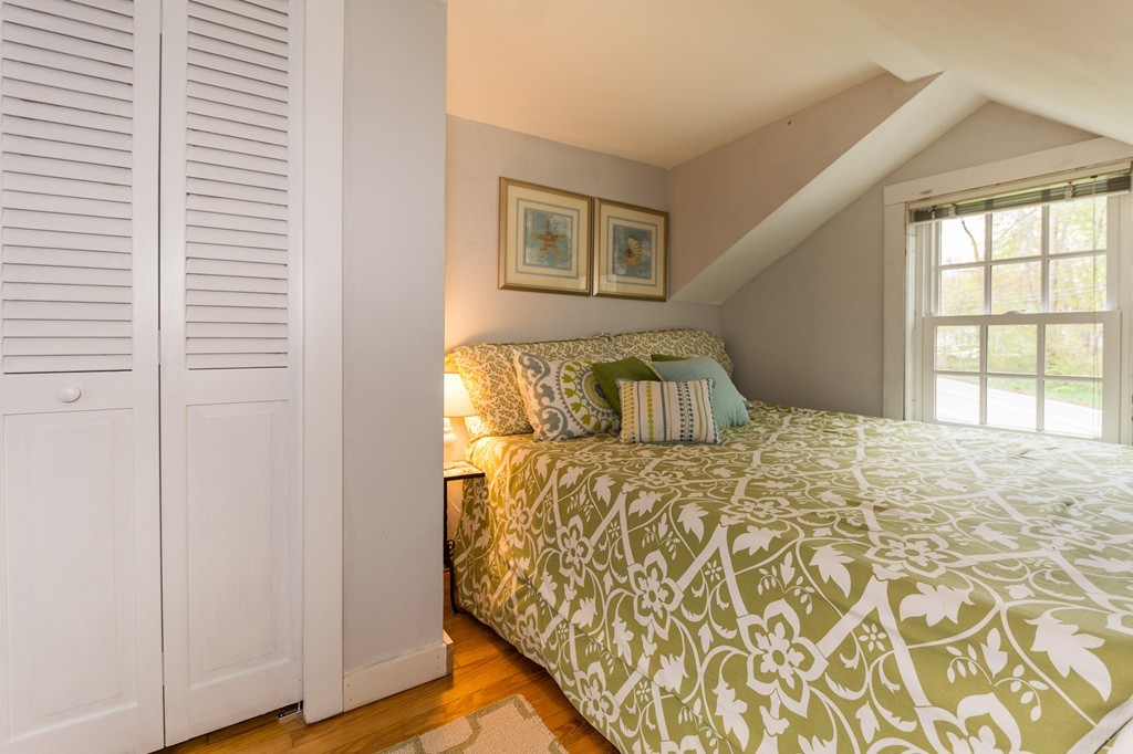 95 Gannett Road Scituate, MA 02066 - Photo 30 of 30 a bedroom with a bed and a window
