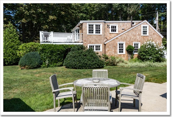95 Gannett Road Scituate, MA 02066 - Photo 6 of 30 a front view of a house with garden