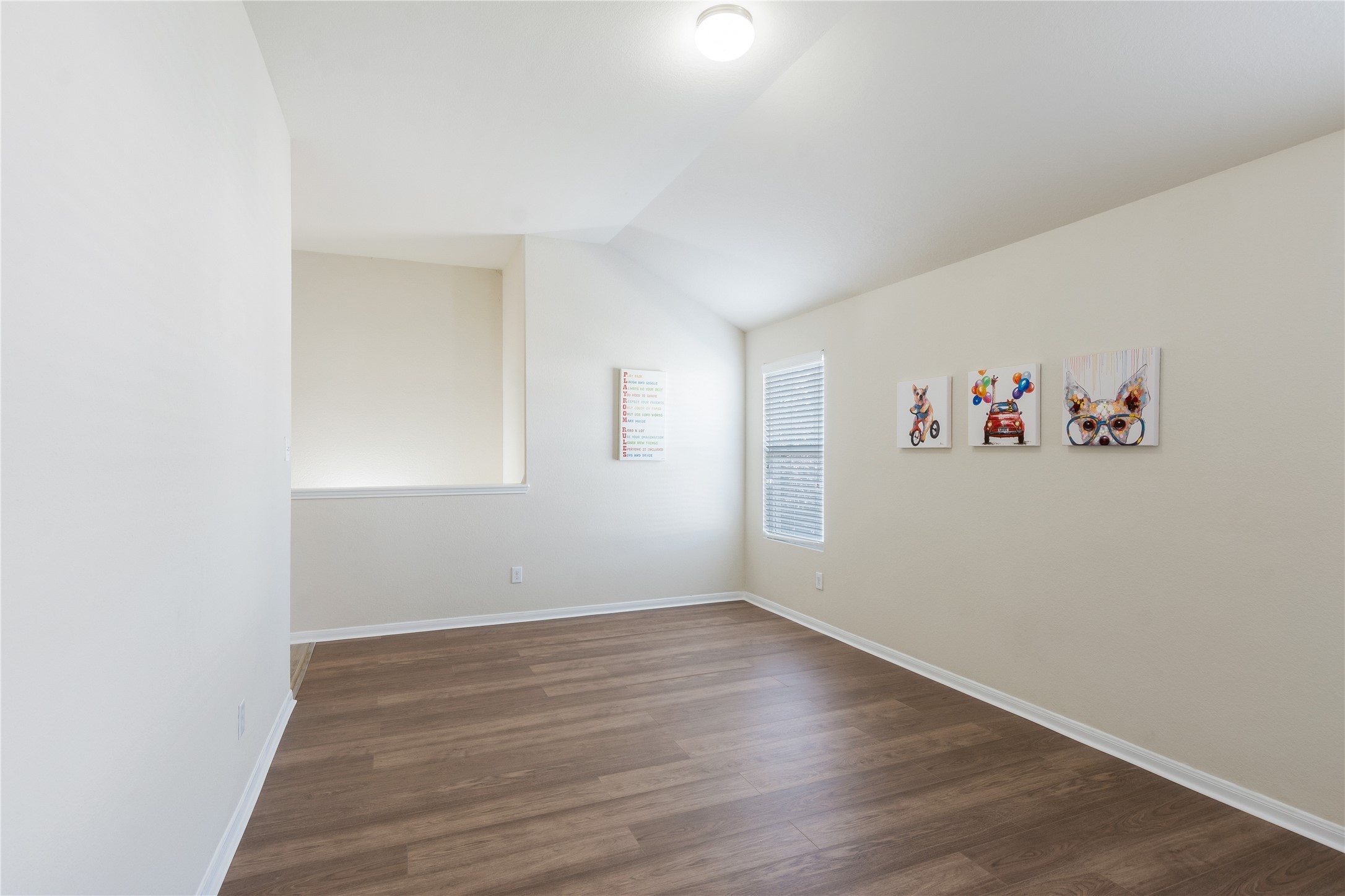 15007 Holland Grove Court Cypress, TX 77433 - Photo 14 of 28 an empty room with a painting on the wall