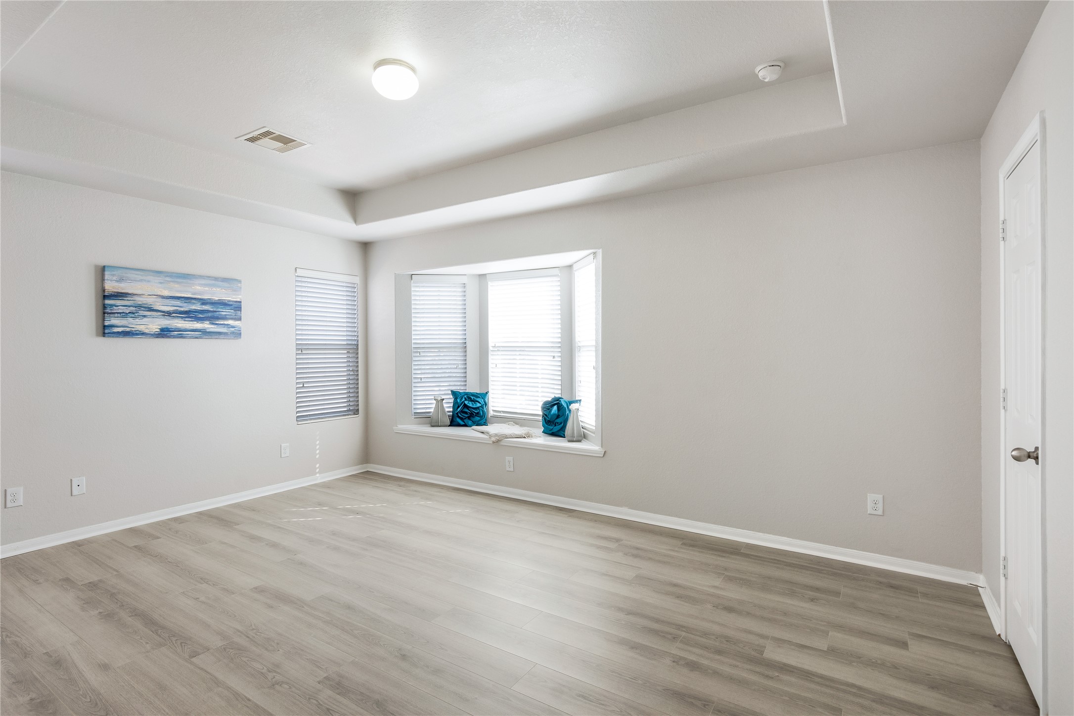 15007 Holland Grove Court Cypress, TX 77433 - Photo 15 of 28 an empty room with wooden floor and windows