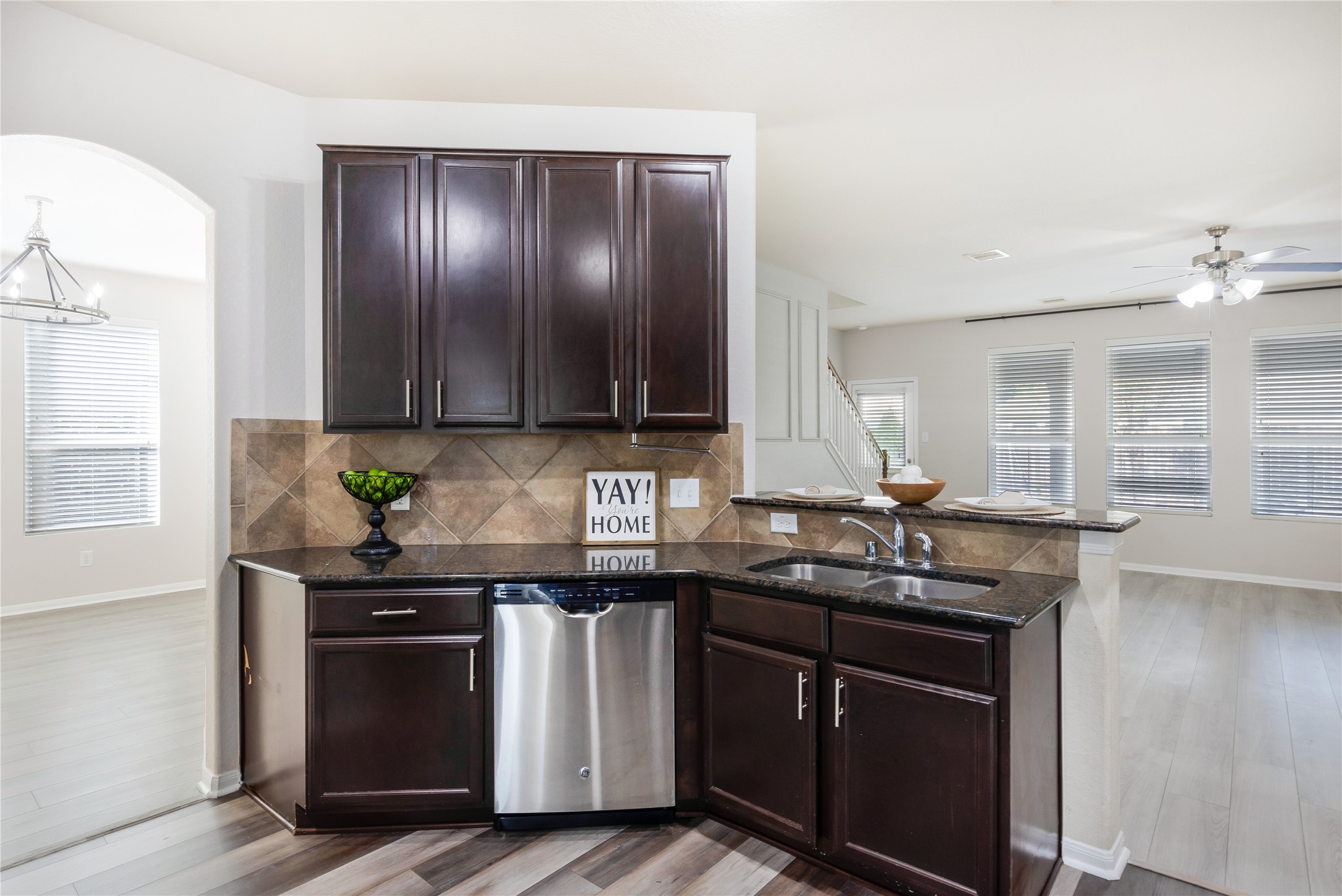 15007 Holland Grove Court Cypress, TX 77433 - Photo 4 of 28 a kitchen with granite countertop cabinets sink and stainless steel appliances