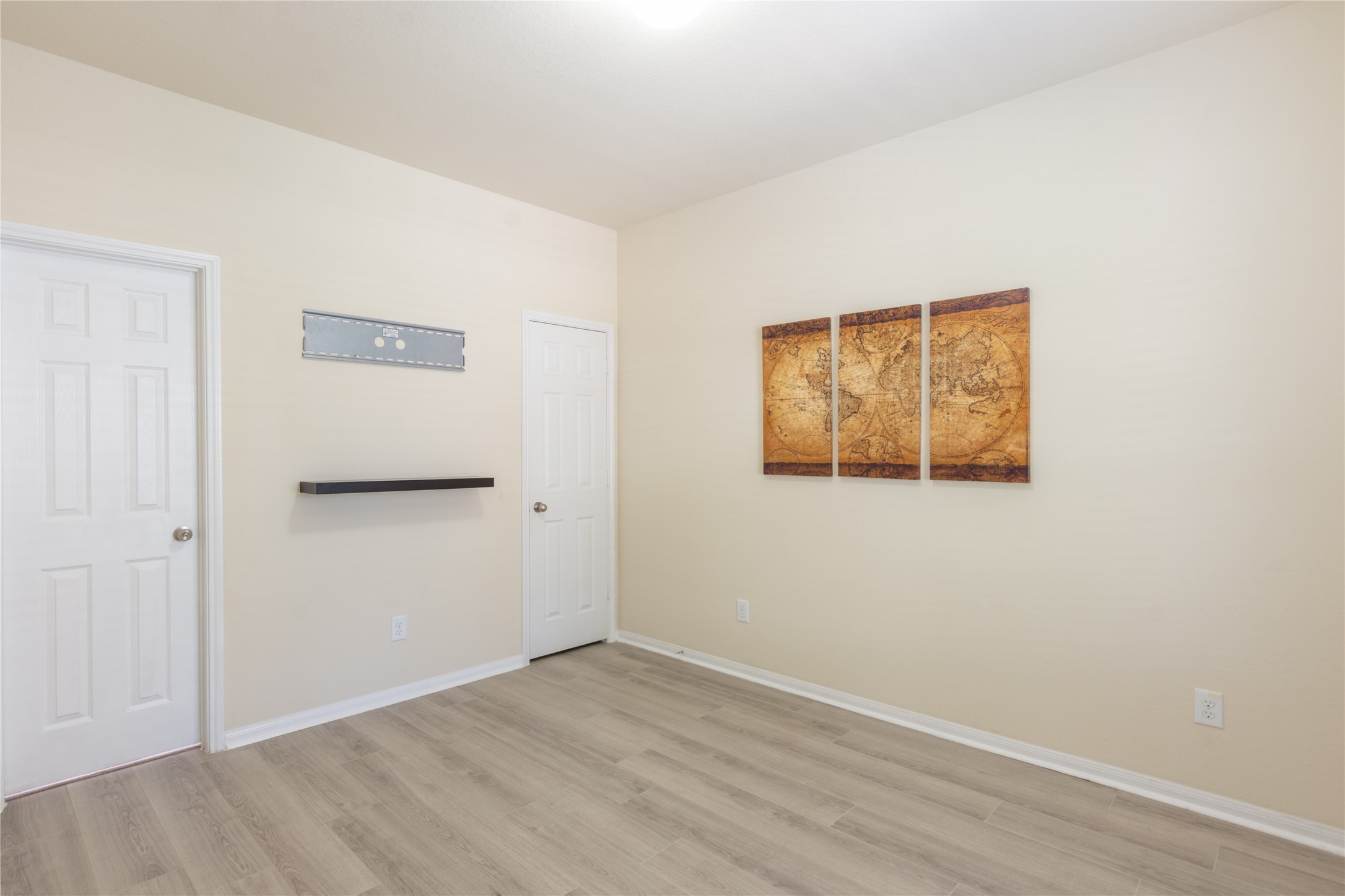 15007 Holland Grove Court Cypress, TX 77433 - Photo 10 of 28 an empty room with wooden floor and windows