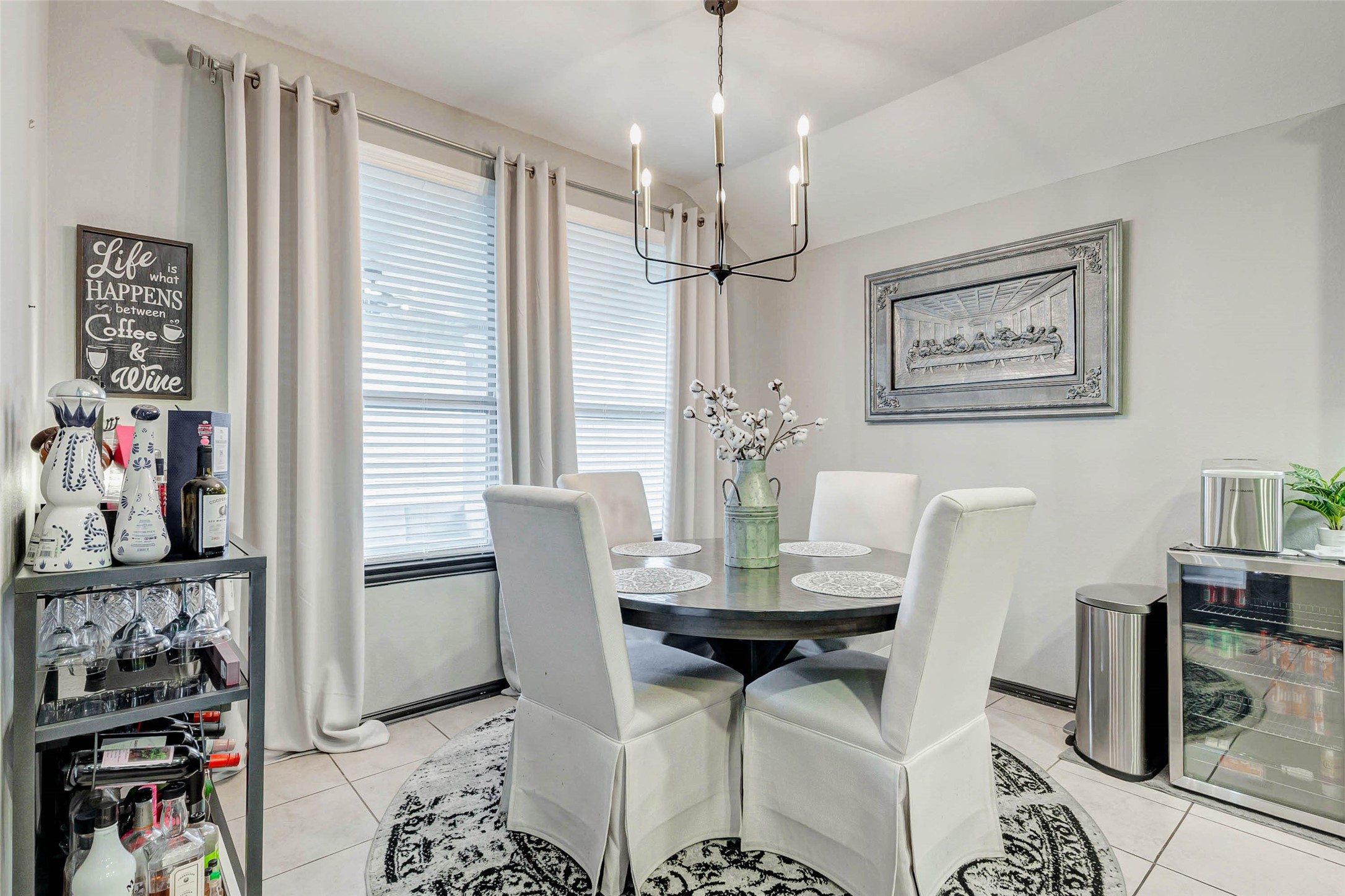 8319 Silent Deep Drive Rosenberg, TX 77469 - Photo 12 of 34 a view of a dining room with furniture and a chandelier