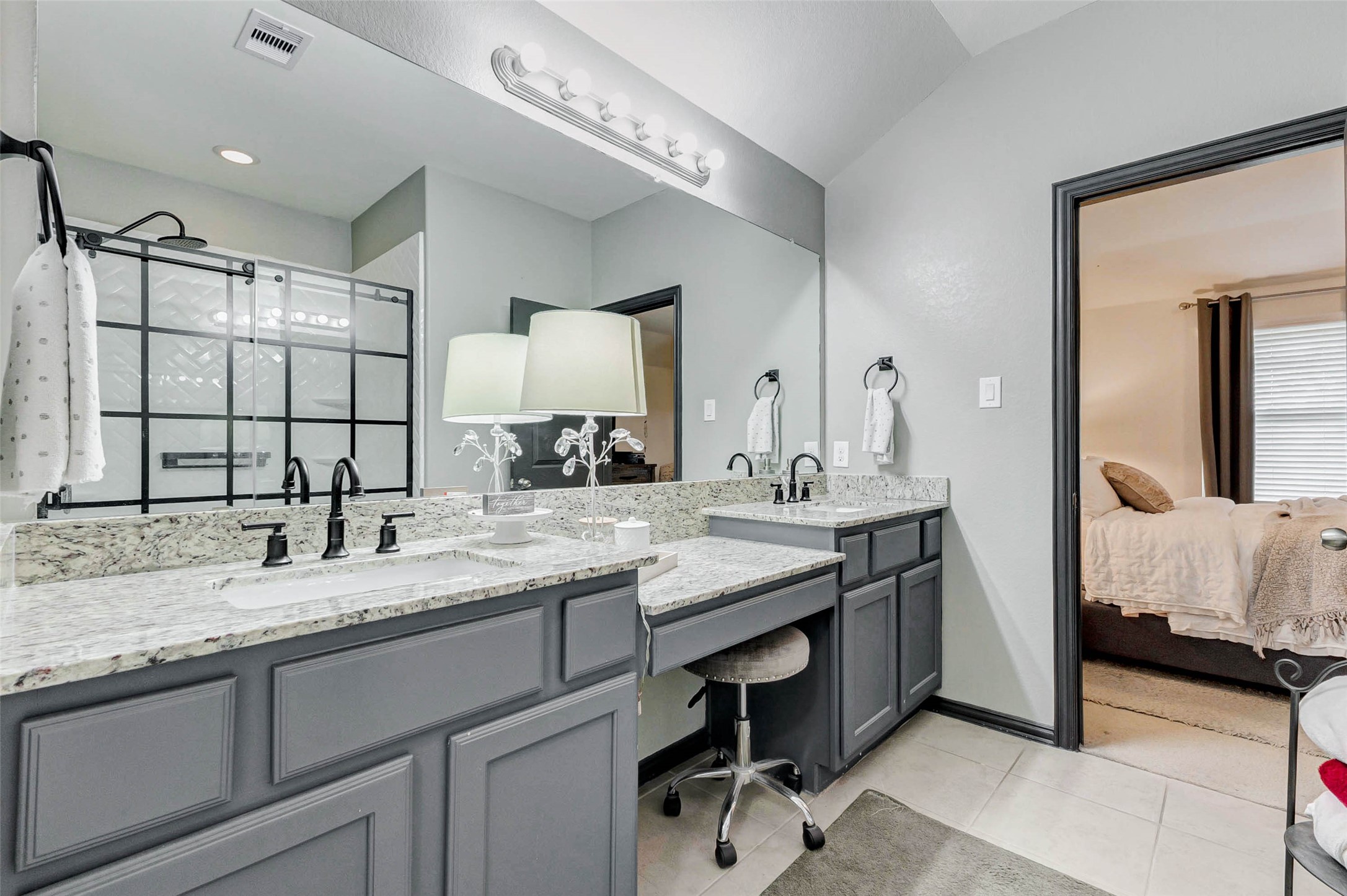 8319 Silent Deep Drive Rosenberg, TX 77469 - Photo 18 of 34 a bathroom with a granite countertop sink and a mirror