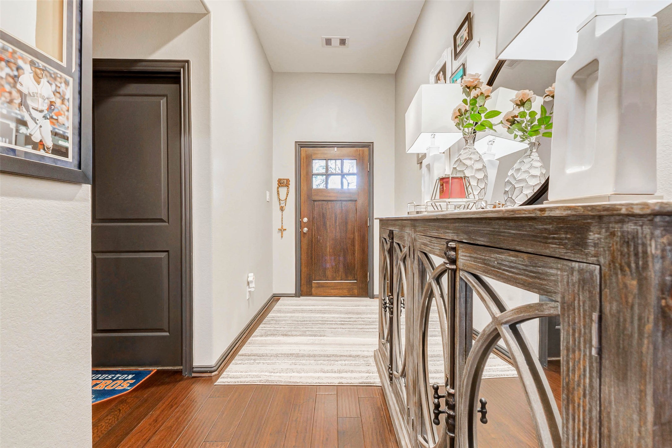 8319 Silent Deep Drive Rosenberg, TX 77469 - Photo 2 of 34 a view of a hallway with wooden floor and staircase