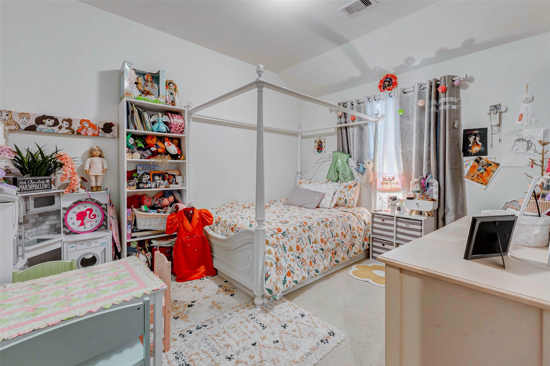 8319 Silent Deep Drive Rosenberg, TX 77469 - Photo 26 of 34 a bedroom with a bed a dresser and a book shelf
