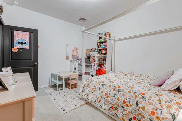 a bedroom with a bed and a cabinets