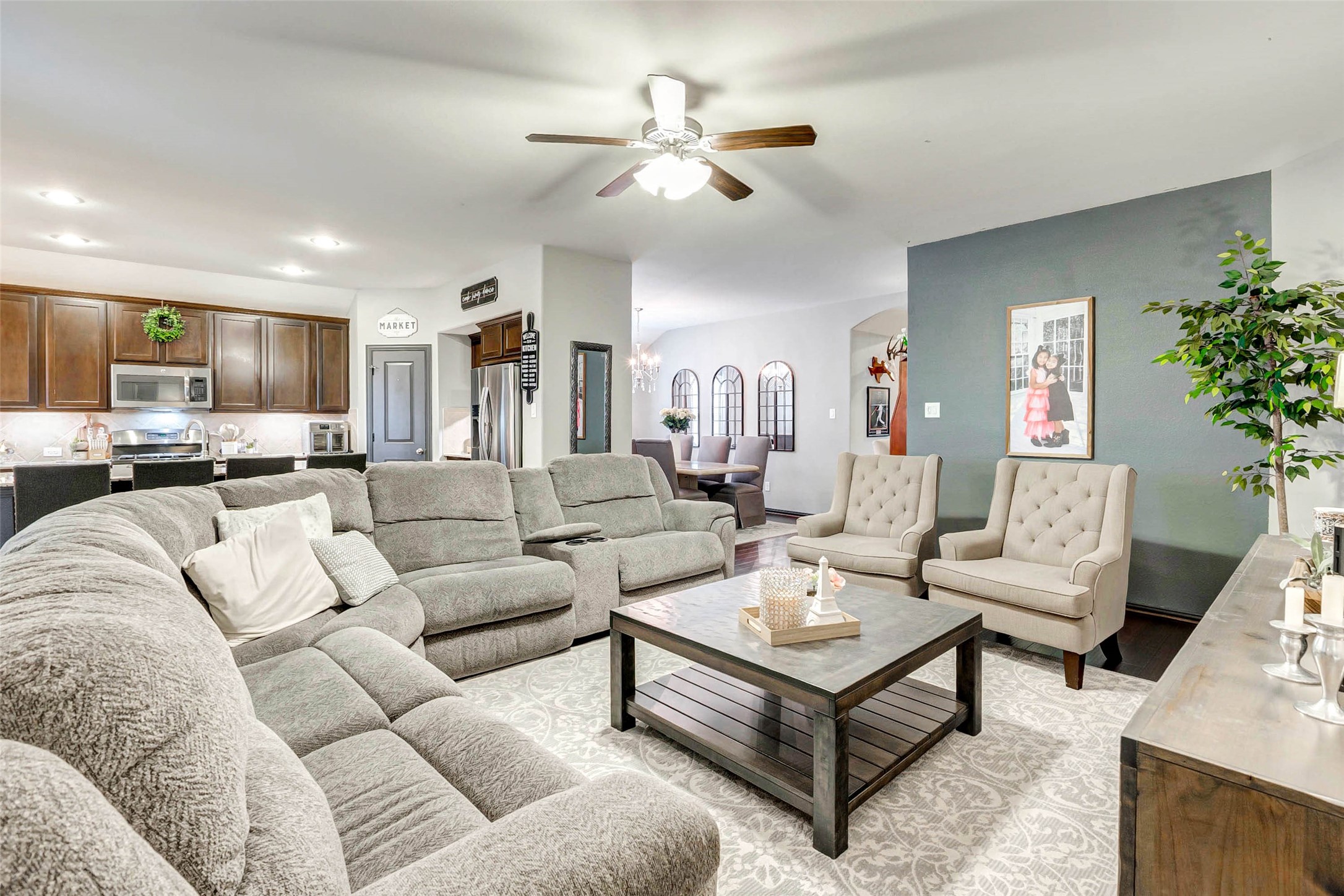 8319 Silent Deep Drive Rosenberg, TX 77469 - Photo 4 of 34 a living room with furniture kitchen view and a chandelier