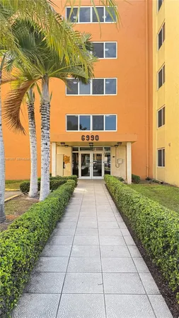 a view of a building with a yard