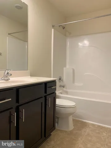 a bathroom with a sink a toilet and a bathtub