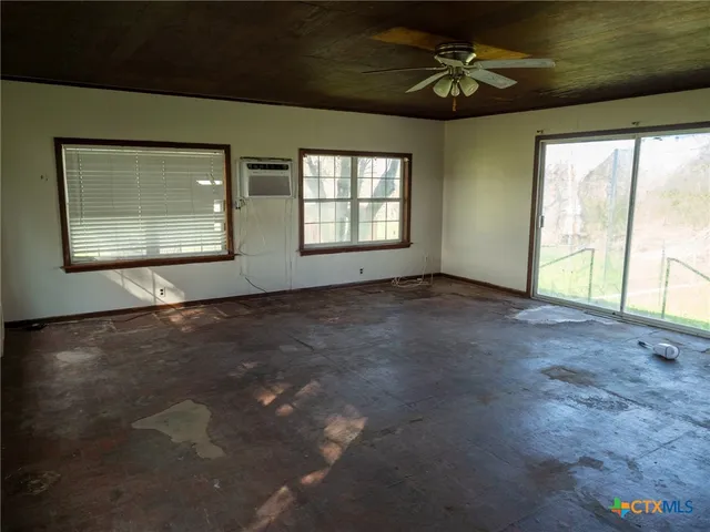 a kitchen with a sink cabinets and appliances