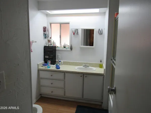 a bathroom with a sink and a mirror