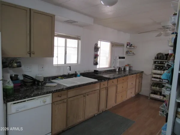 a kitchen with a sink and cabinets