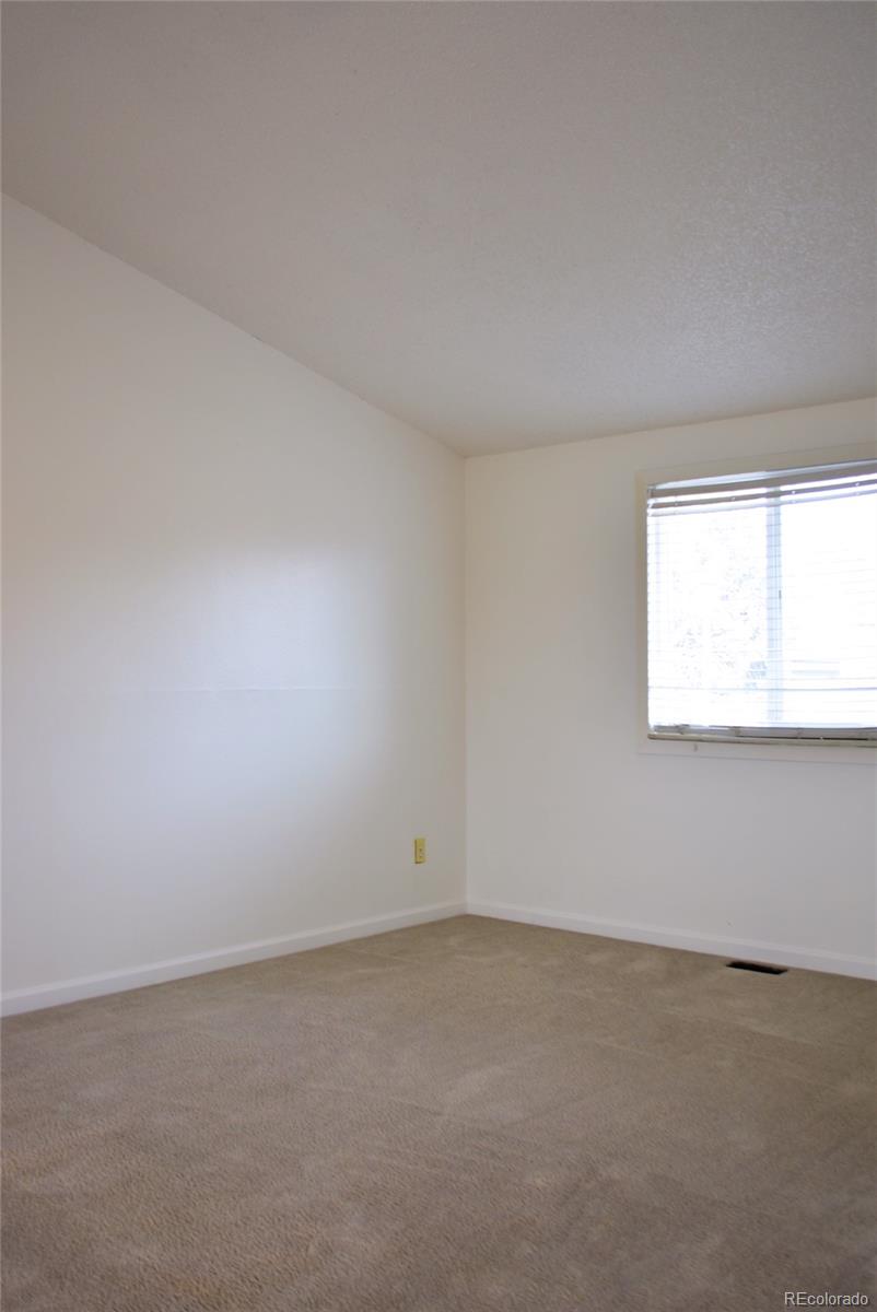 2087 South Quintero Street Aurora, CO 80013 - Photo 13 of 34 an empty room with a window