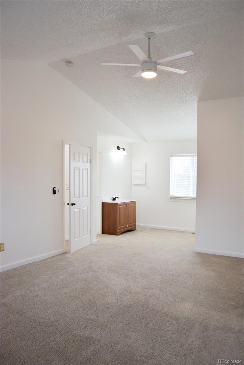 2087 South Quintero Street Aurora, CO 80013 - Photo 16 of 34 a view of an empty room with a window