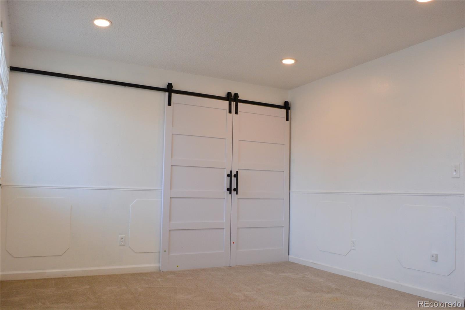 2087 South Quintero Street Aurora, CO 80013 - Photo 22 of 34 a view of a garage