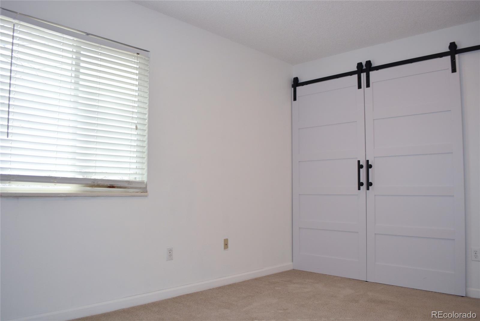2087 South Quintero Street Aurora, CO 80013 - Photo 24 of 34 a view of a room that has a window in it