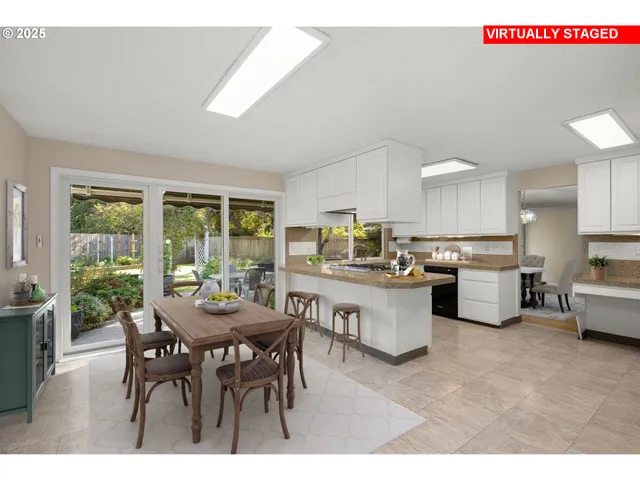 a kitchen with a table and chairs in it