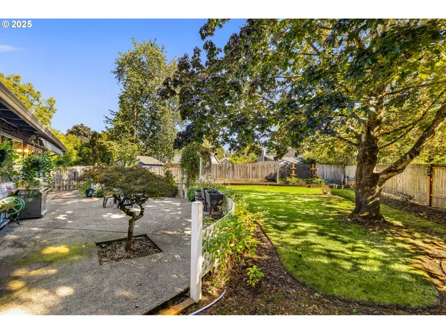 a view of yard with swimming pool