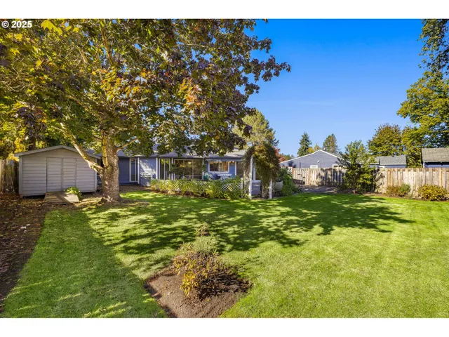 a backyard of a house with lots of green space