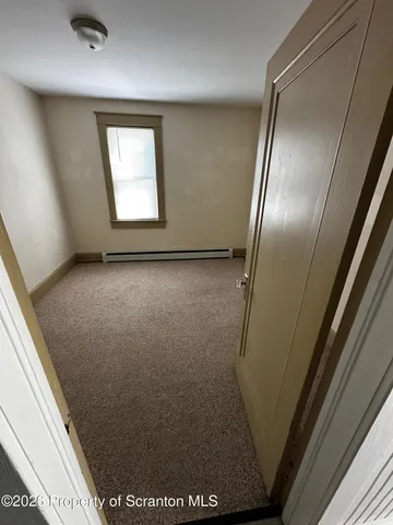 an empty room with a bench