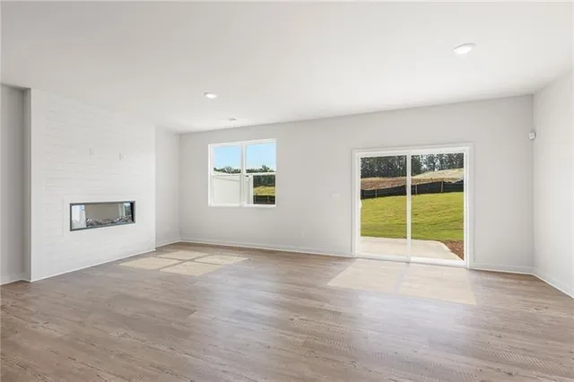 a view of a hallway with wooden shelves