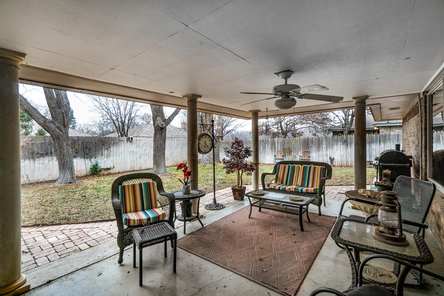 6405 Ridgewood Drive Amarillo, TX 79109 - Photo 18 of 25 a living room with furniture and a floor to ceiling window