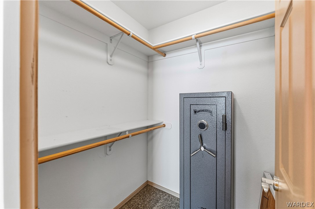3973 Prairie View Drive Kingman, AZ 86409 - Photo 25 of 34 Interior closet with white shelving and hanging rods